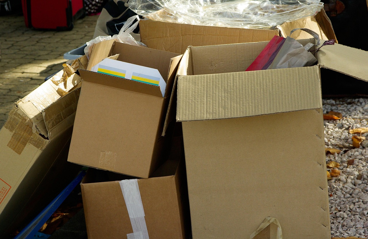 Cardboard boxes half packed and open, ready for moving day